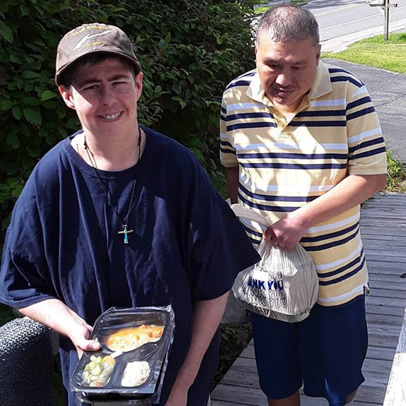 Site Based Habilitation Program Members Helping Meals on Wheels